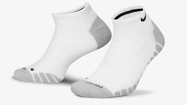 Side view of white and grey Nike socks.